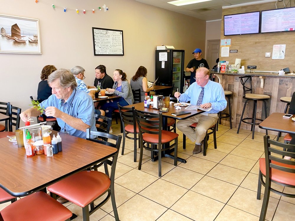 Customers are eating Vietnamese food at Little Saigon Cafe